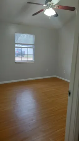 a view of an empty room with a window