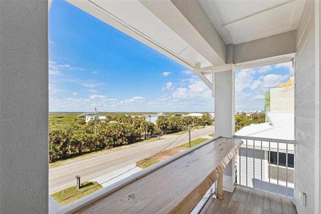 6191 Turtlemound Road New Smyrna Beach, FL 32169 - Photo 24 of 90 a view of roof deck with wooden floor and outdoor space