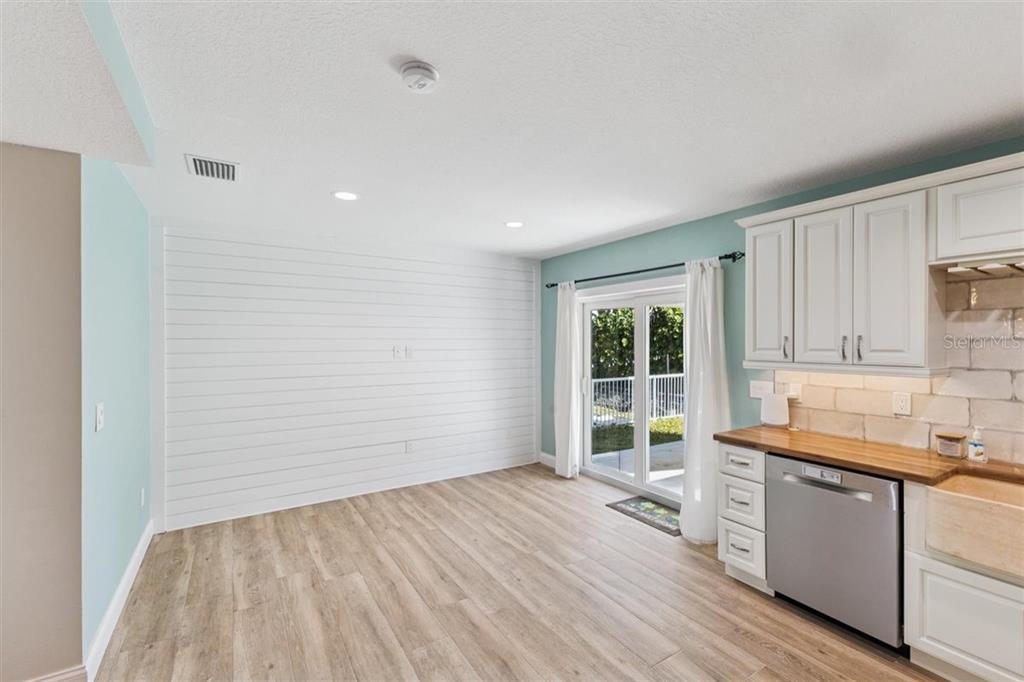 6191 Turtlemound Road New Smyrna Beach, FL 32169 - Photo 35 of 90 a view of a kitchen with a sink and a window