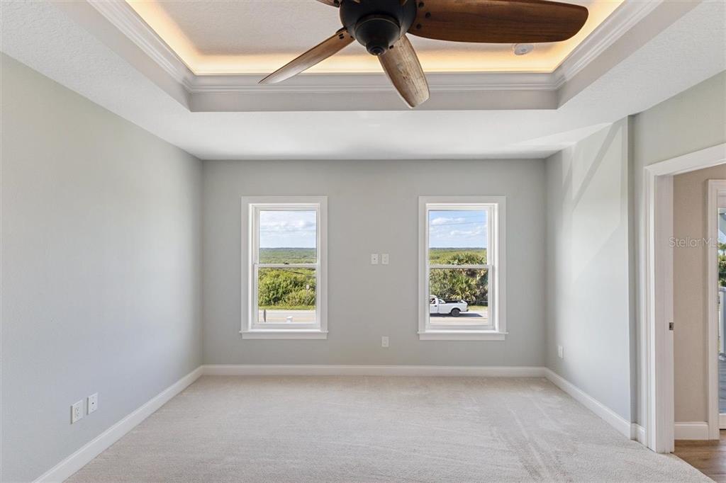6191 Turtlemound Road New Smyrna Beach, FL 32169 - Photo 42 of 90 an empty room with windows