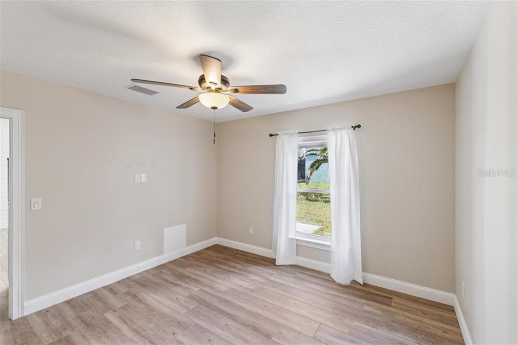 6191 Turtlemound Road New Smyrna Beach, FL 32169 - Photo 49 of 90 a view of an empty room with a window
