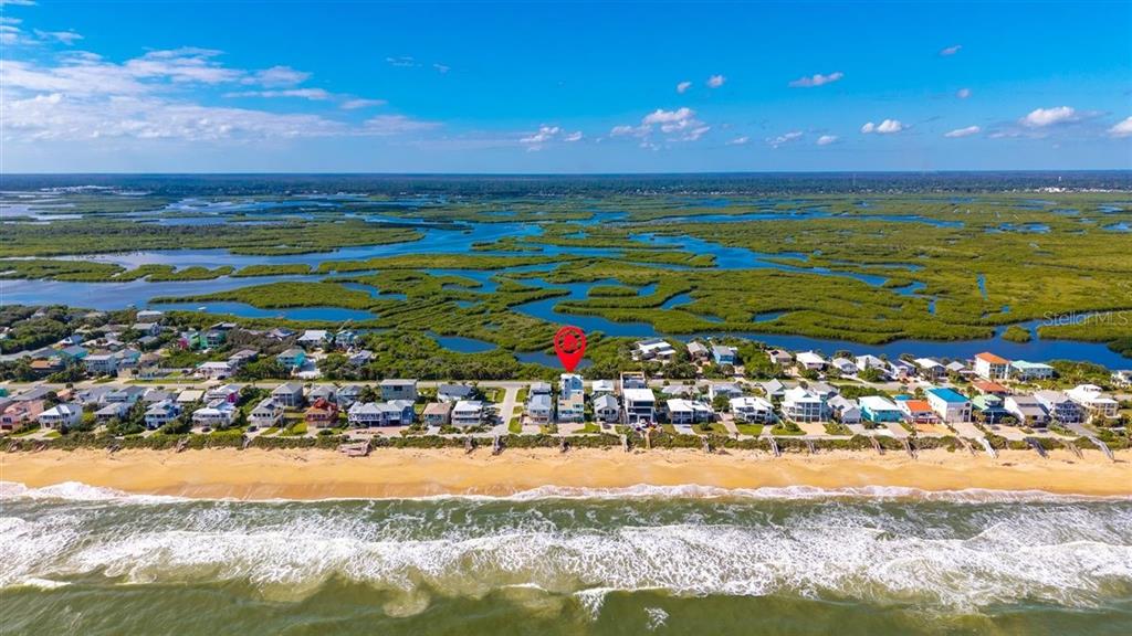 6191 Turtlemound Road New Smyrna Beach, FL 32169 - Photo 6 of 90 a view of an ocean and beach
