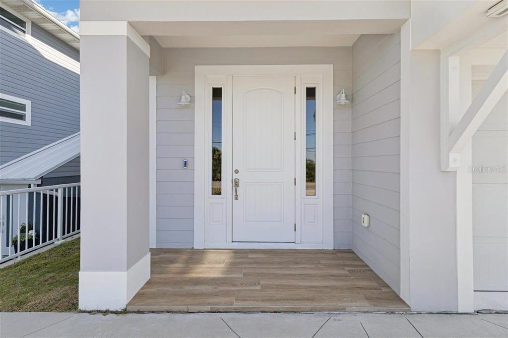 6191 Turtlemound Road New Smyrna Beach, FL 32169 - Photo 7 of 90 a view of a hallway with wooden floor and staircase