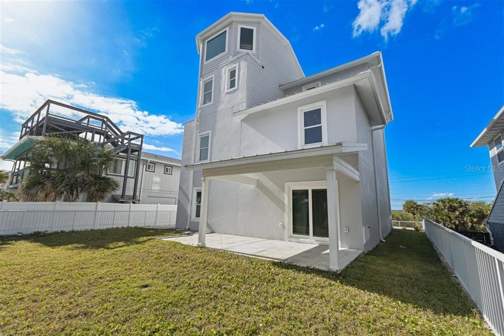 6191 Turtlemound Road New Smyrna Beach, FL 32169 - Photo 74 of 90 a front view of a house with a yard
