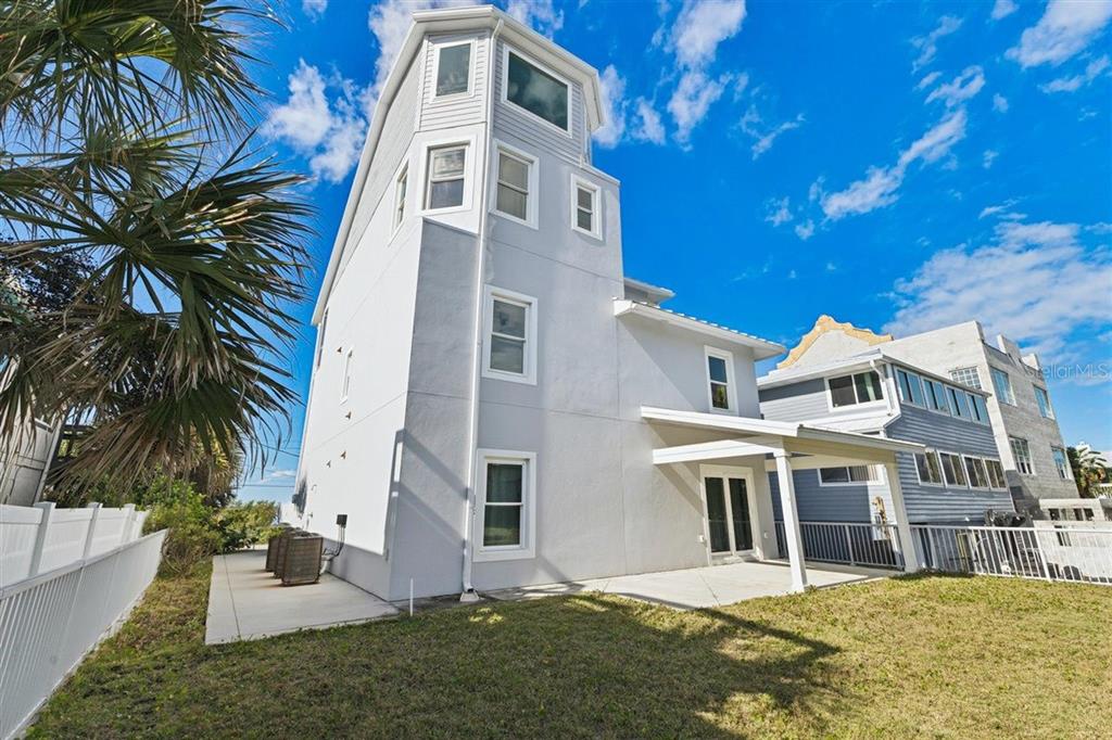 6191 Turtlemound Road New Smyrna Beach, FL 32169 - Photo 75 of 90 a view of a building with a yard