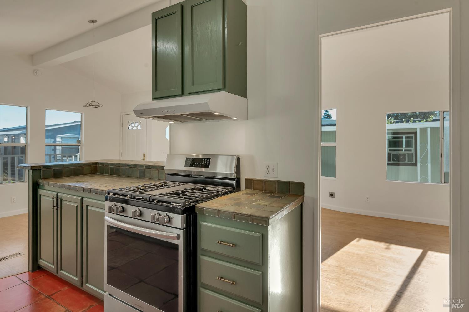 49 Ramon Street Sonoma, CA 95476 - Photo 11 of 39 a kitchen with stainless steel appliances granite countertop a stove and a microwave