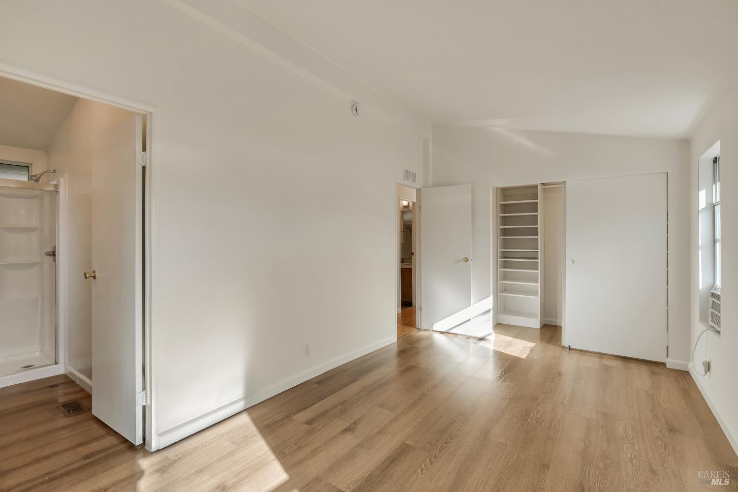 49 Ramon Street Sonoma, CA 95476 - Photo 26 of 39 an empty room with wooden floor and windows