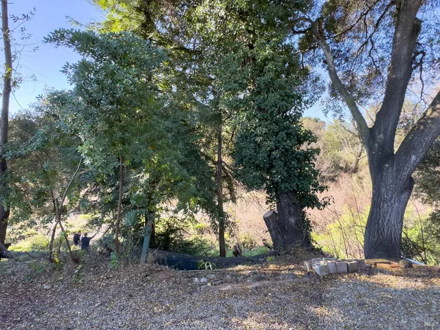 a view of a house with a wooden deck