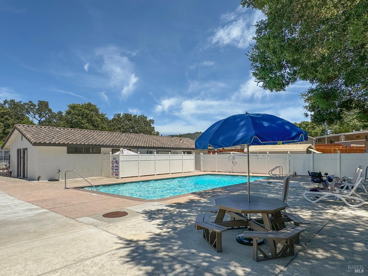 49 Ramon Street Sonoma, CA 95476 - Photo 34 of 39 a view of a backyard with table and chairs under an umbrella