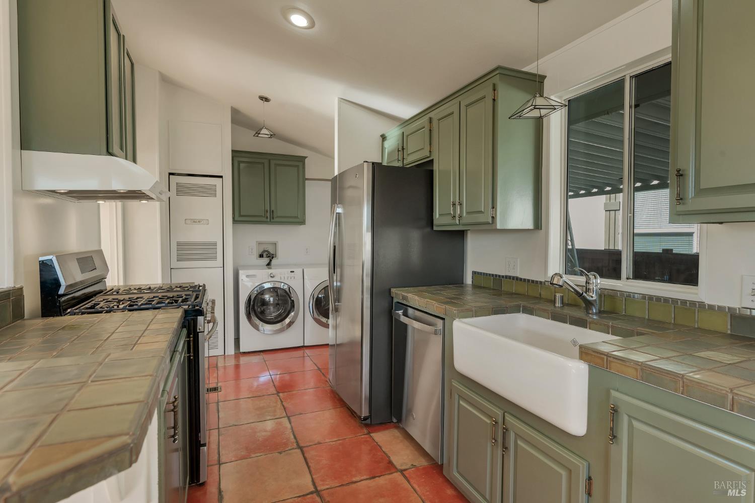 49 Ramon Street Sonoma, CA 95476 - Photo 9 of 39 a kitchen with stainless steel appliances granite countertop a sink stove and refrigerator