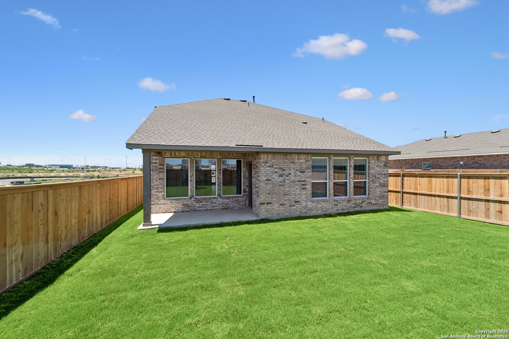 129 Radnor Road New Braunfels, TX 78130 - Photo 7 of 8 a view of a house with a backyard