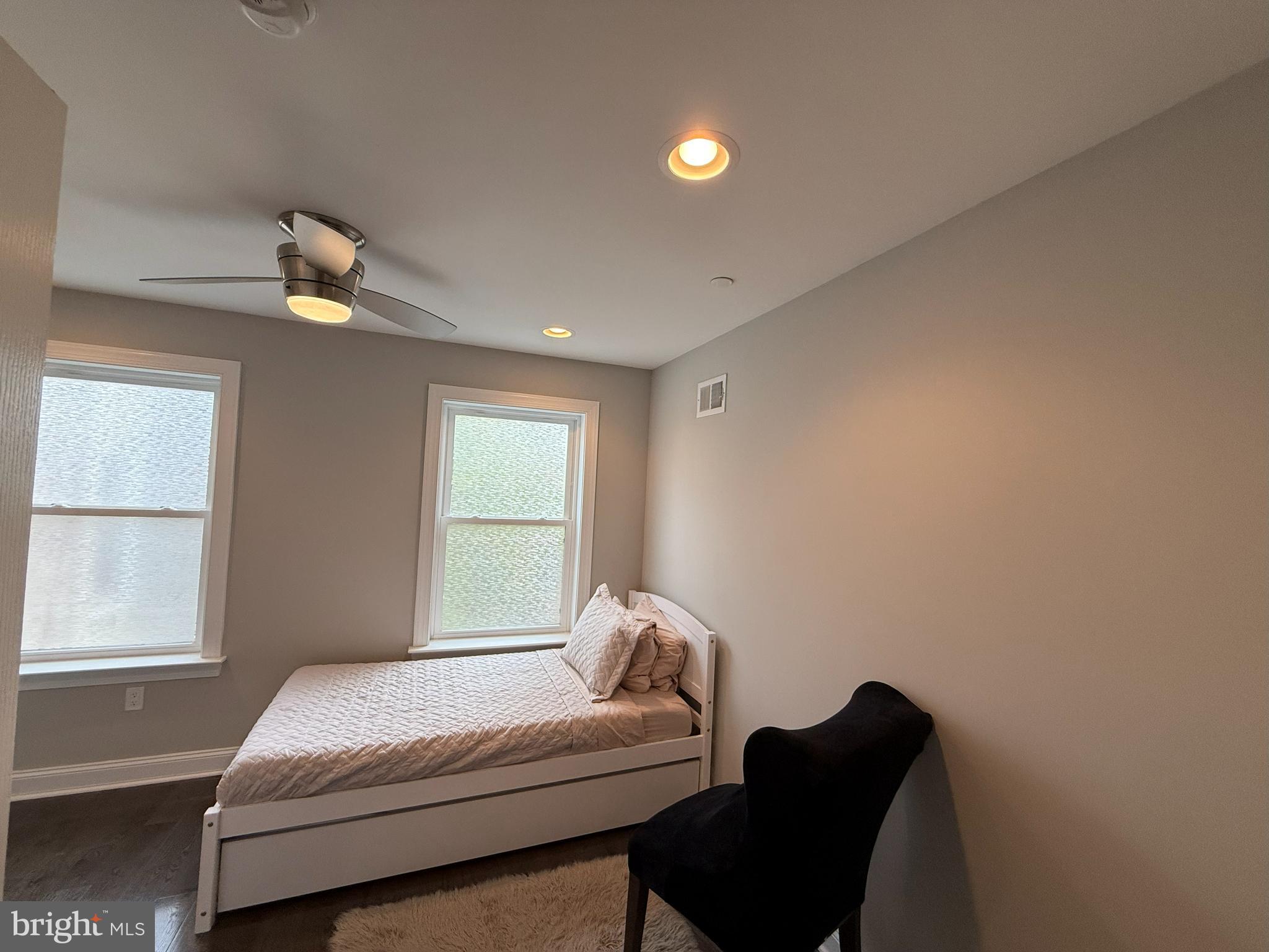 2131 North 10th Street Philadelphia, PA 19122 - Photo 13 of 18 a bedroom with a bed and window