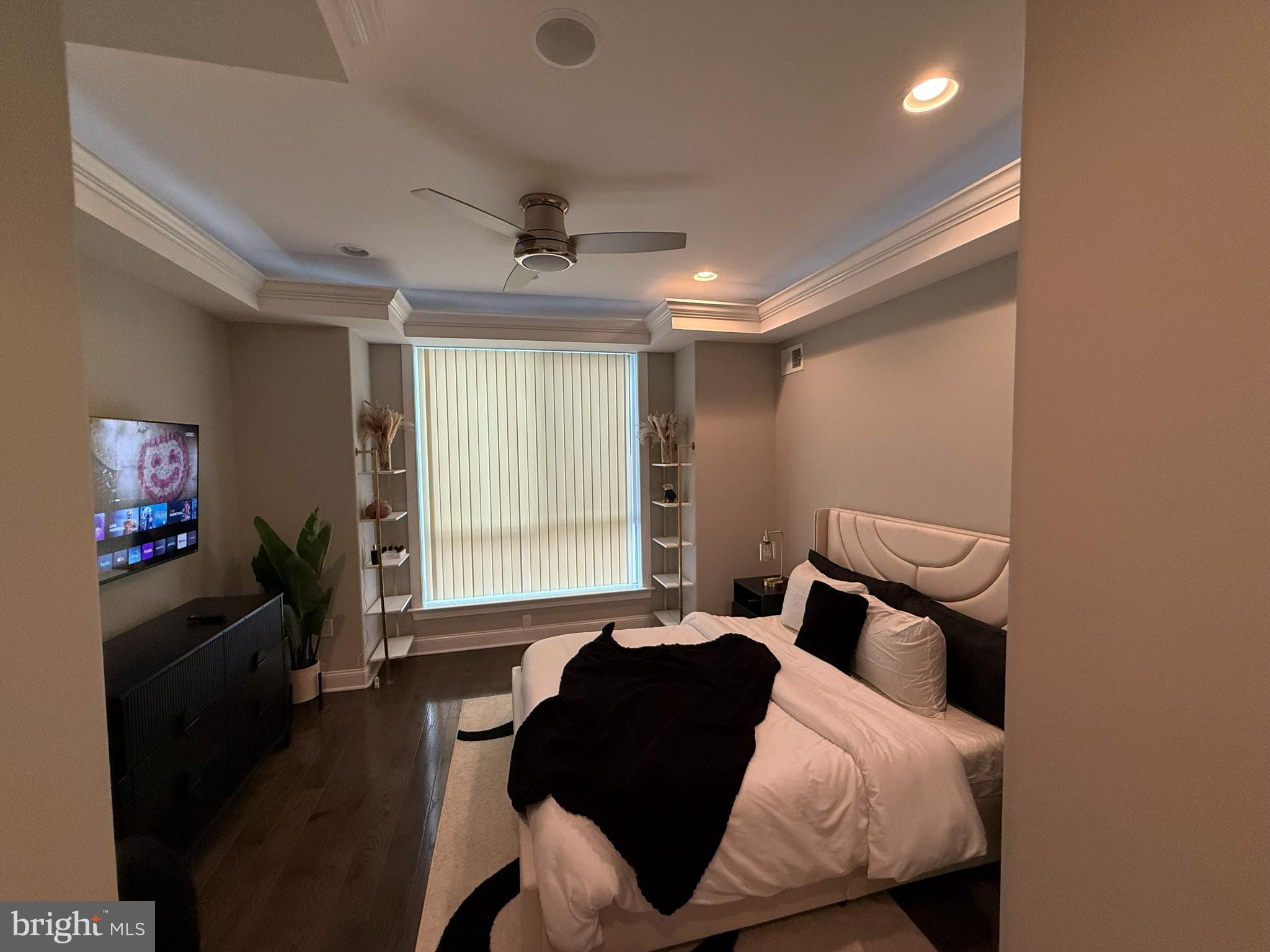 2131 North 10th Street Philadelphia, PA 19122 - Photo 8 of 18 a bedroom with a bed and wooden floor