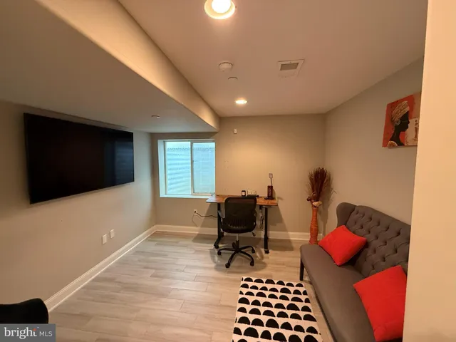 a bedroom with furniture and a window