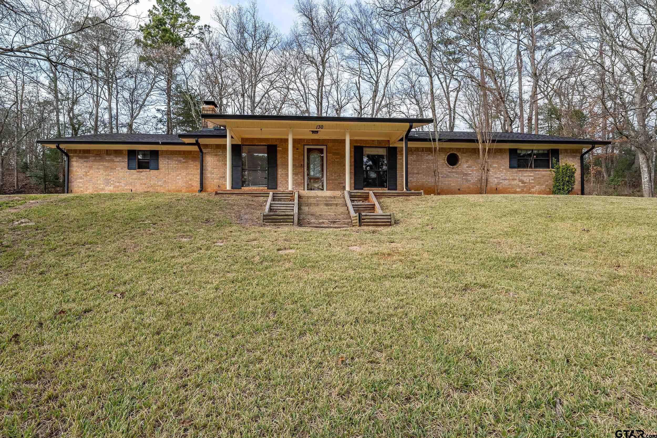 front view of a house with a yard
