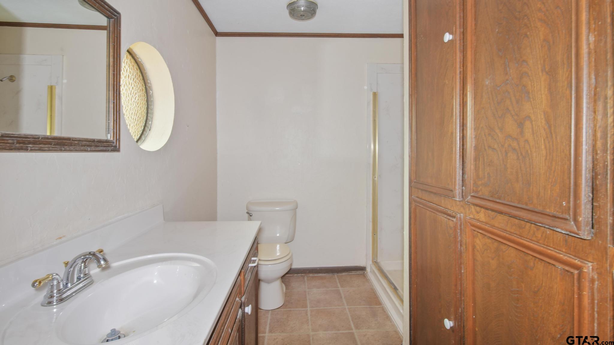 130 Golfcrest Drive Rusk, TX 75785 - Photo 14 of 23 a bathroom with a sink and a mirror