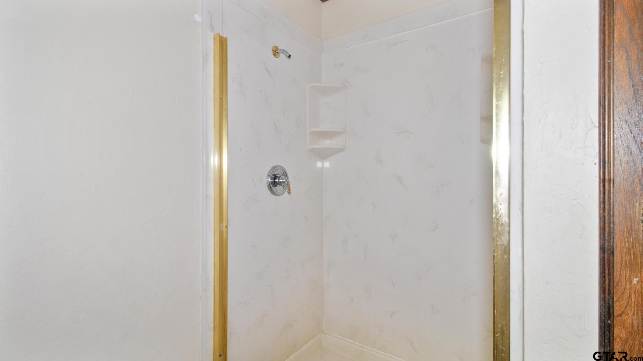 130 Golfcrest Drive Rusk, TX 75785 - Photo 15 of 23 a bathroom with a shower