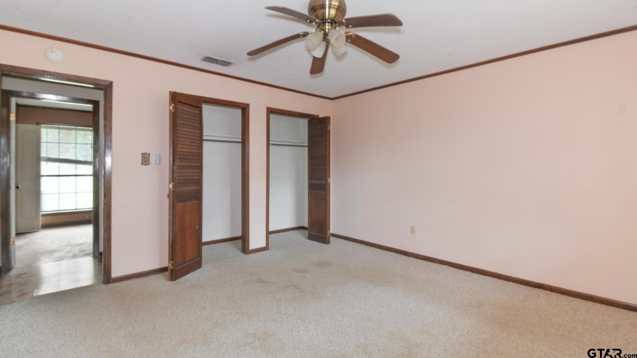 130 Golfcrest Drive Rusk, TX 75785 - Photo 16 of 23 an empty room with chandelier fan