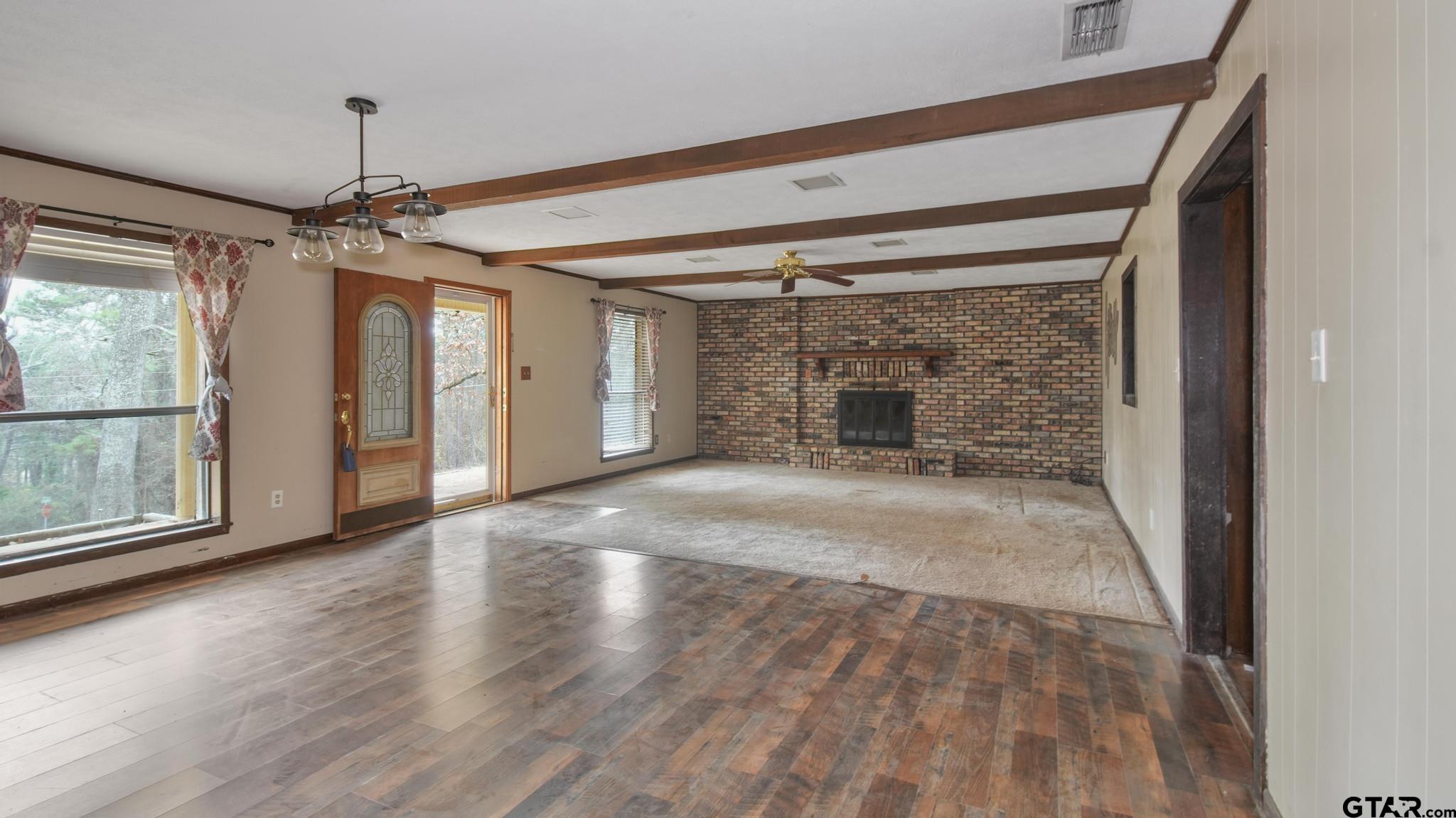 130 Golfcrest Drive Rusk, TX 75785 - Photo 17 of 23 a view of empty room with wooden floor and fan