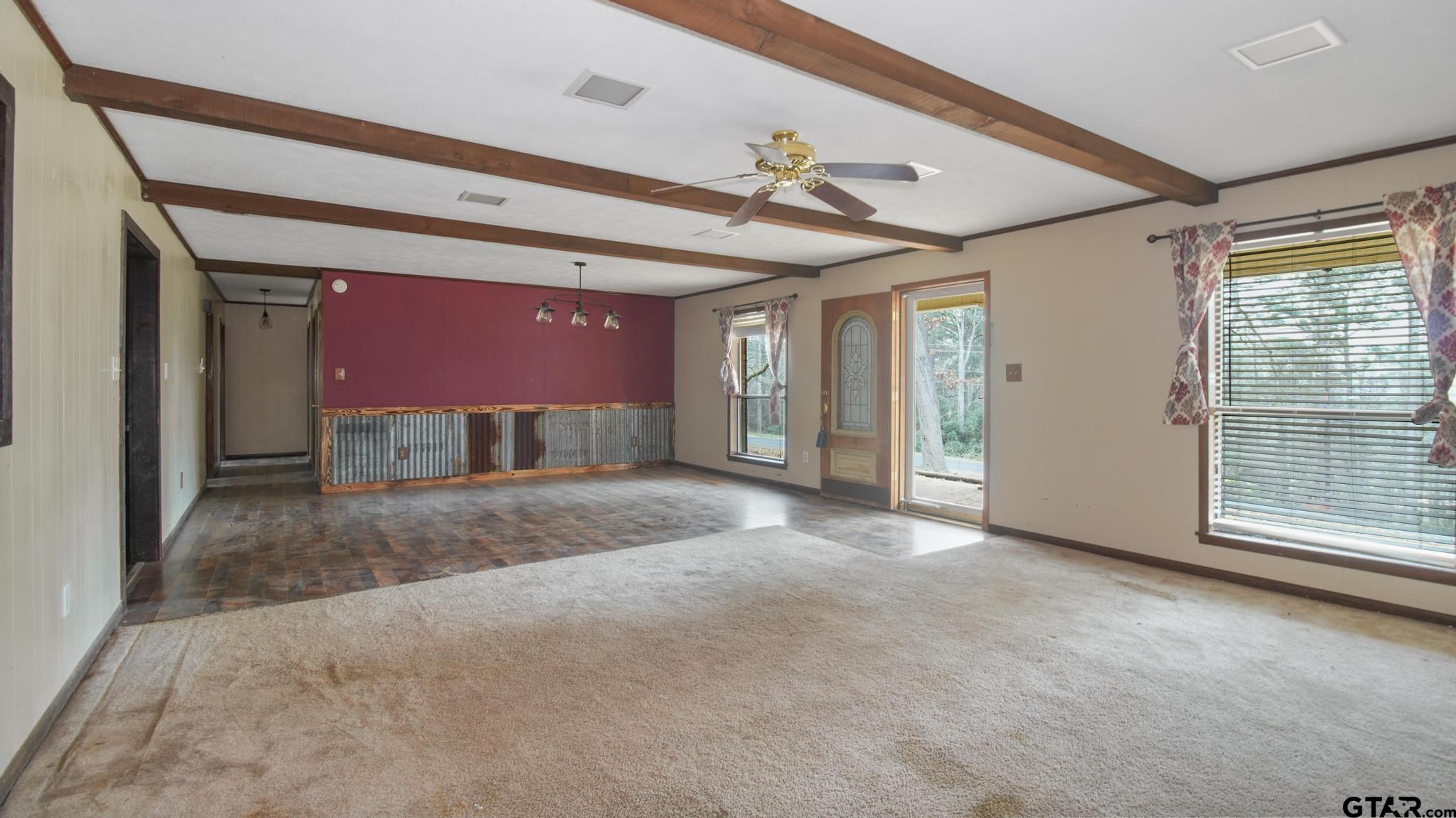 130 Golfcrest Drive Rusk, TX 75785 - Photo 18 of 23 a view of an empty room with a fireplace and a window