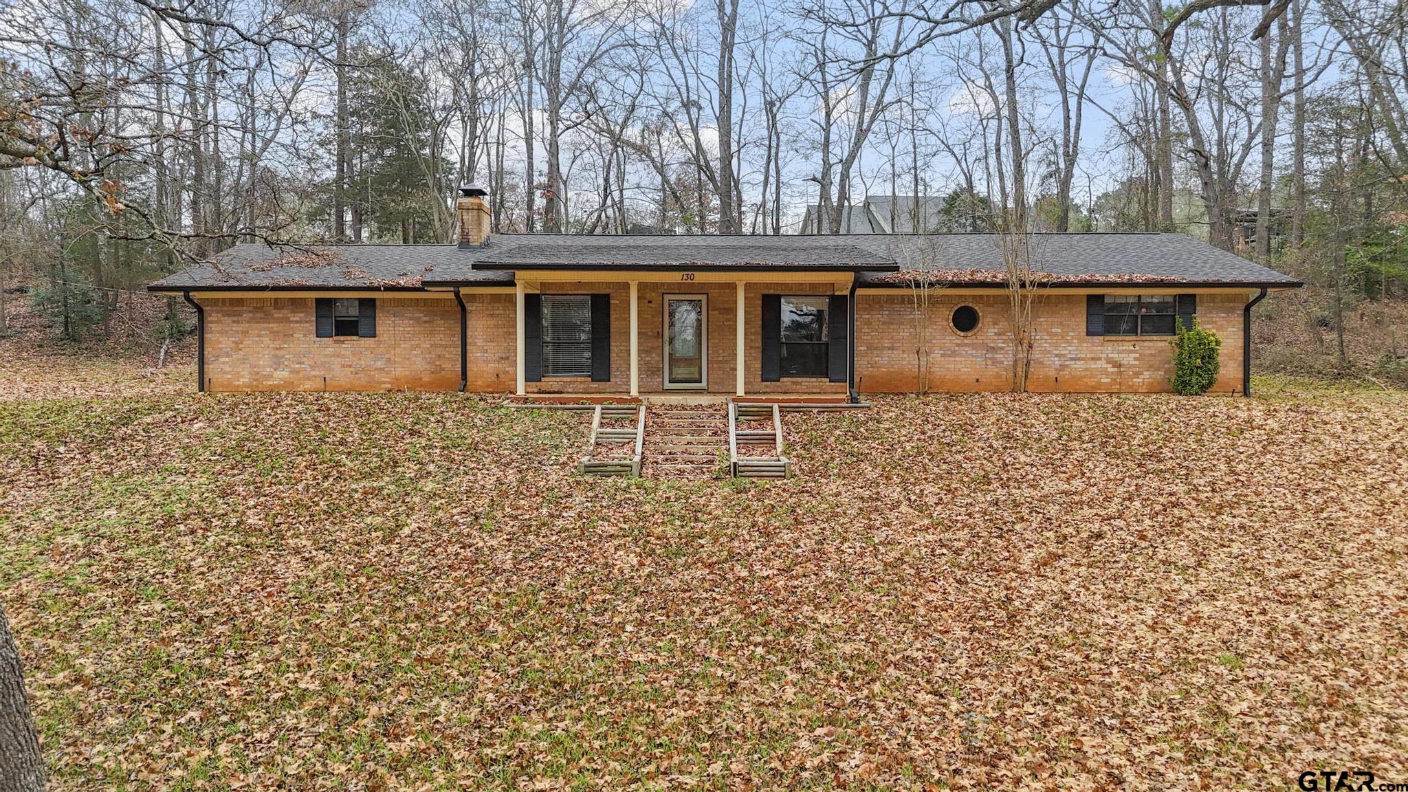 130 Golfcrest Drive Rusk, TX 75785 - Photo 2 of 23 front view of a house with a yard
