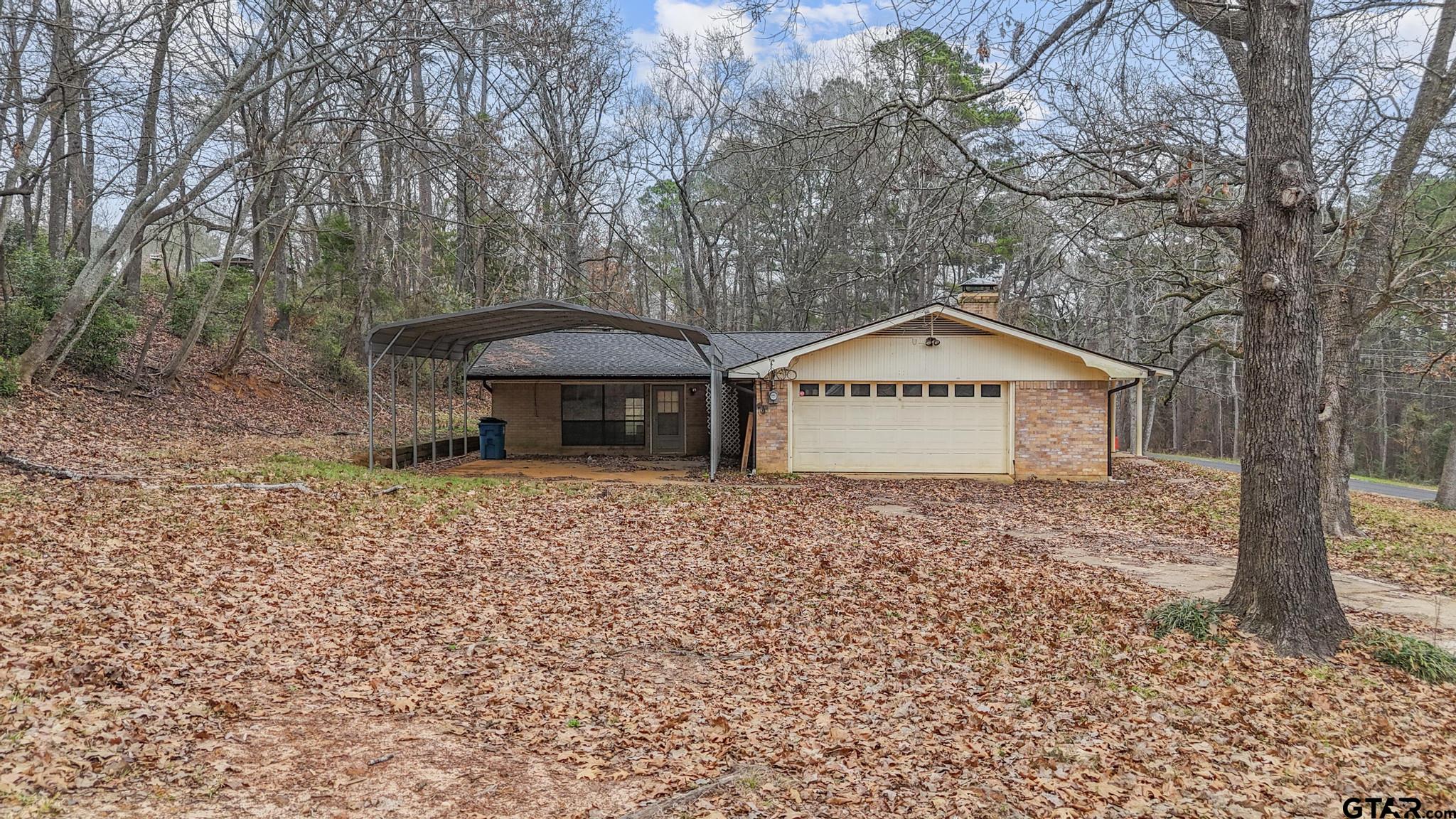 130 Golfcrest Drive Rusk, TX 75785 - Photo 3 of 23 a front view of a house with garden