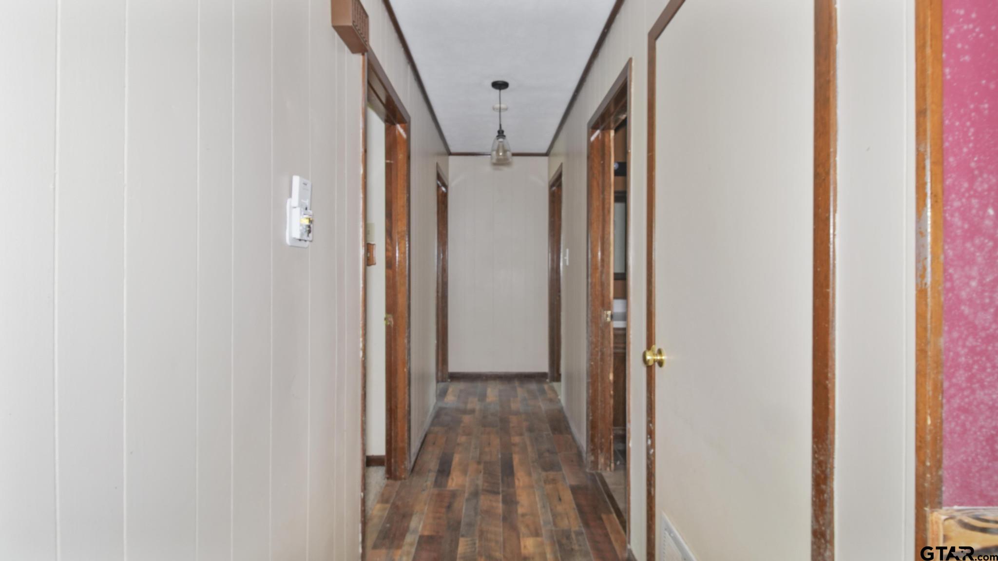 130 Golfcrest Drive Rusk, TX 75785 - Photo 7 of 23 a view of hallway with wooden floor and stairs