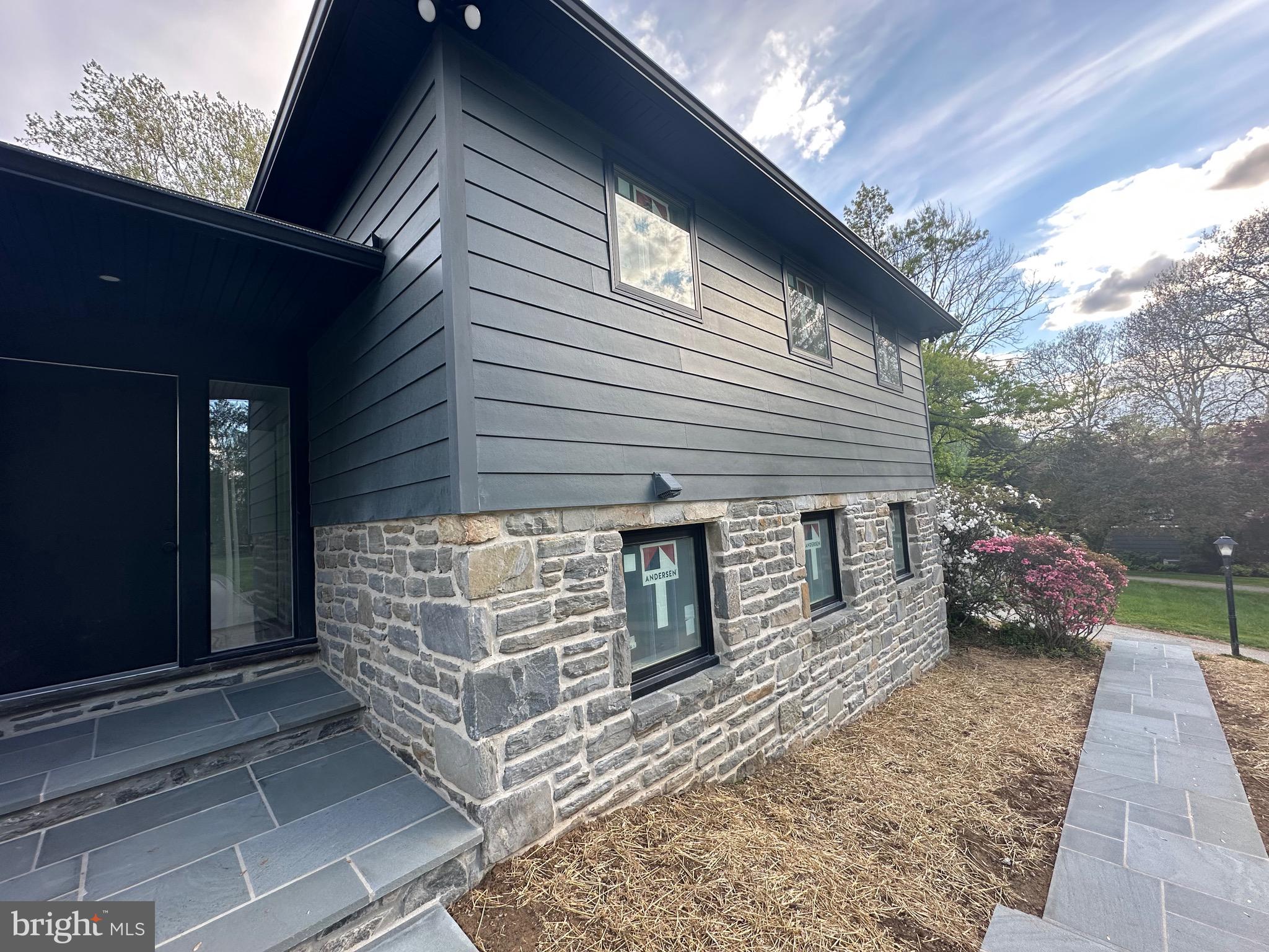 713 Woodfield Road Villanova, PA 19085 - Photo 34 of 36 a side view of a house with a yard