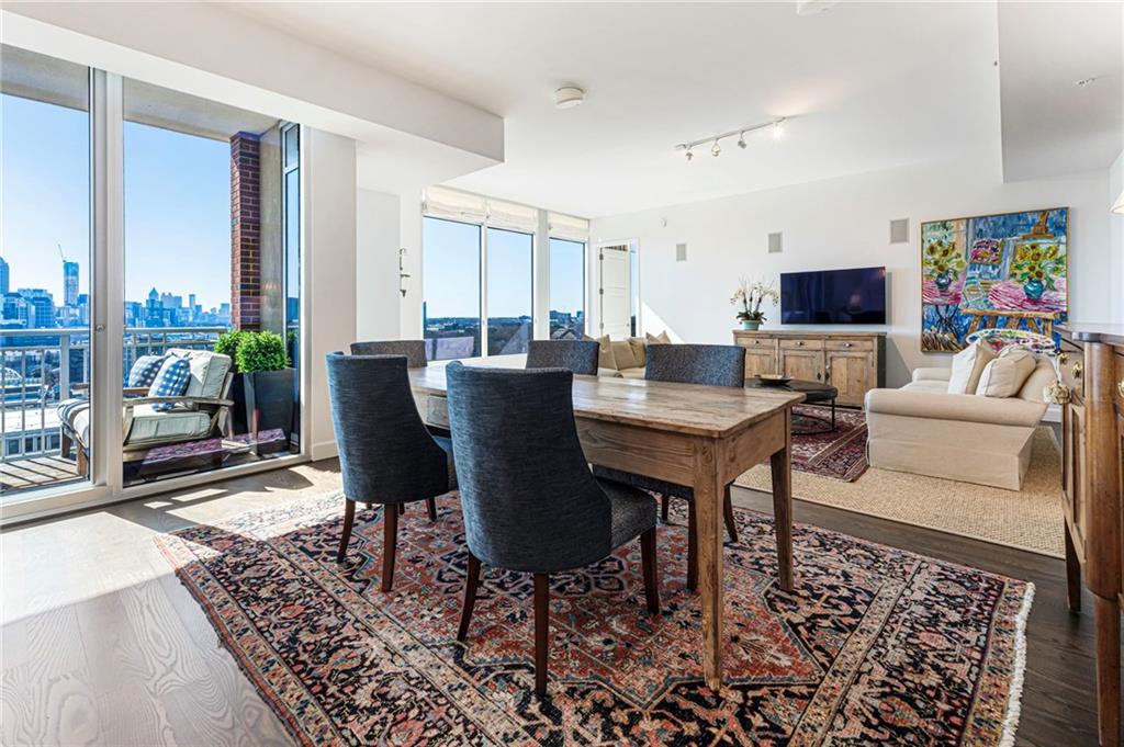 1820 Peachtree Road Northwest, Unit 1510 Atlanta, GA 30309 - Photo 14 of 75 a living room with furniture and a flat screen tv