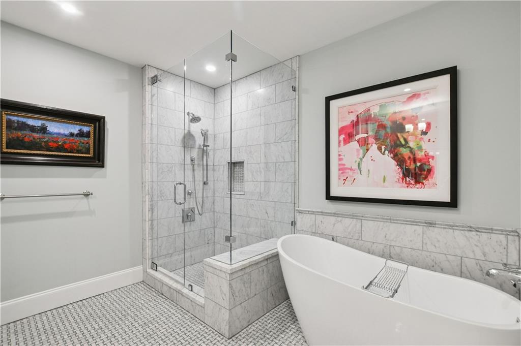1820 Peachtree Road Northwest, Unit 1510 Atlanta, GA 30309 - Photo 26 of 75 a bathroom with a bathtub and a shower