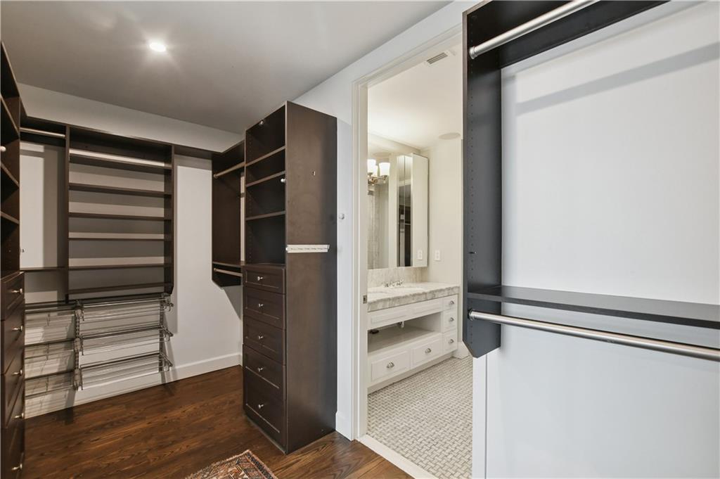 1820 Peachtree Road Northwest, Unit 1510 Atlanta, GA 30309 - Photo 28 of 75 a view of walk in closet with clothes and shoes