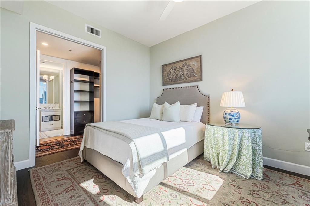 1820 Peachtree Road Northwest, Unit 1510 Atlanta, GA 30309 - Photo 32 of 75 a bedroom with a bed and a night stand