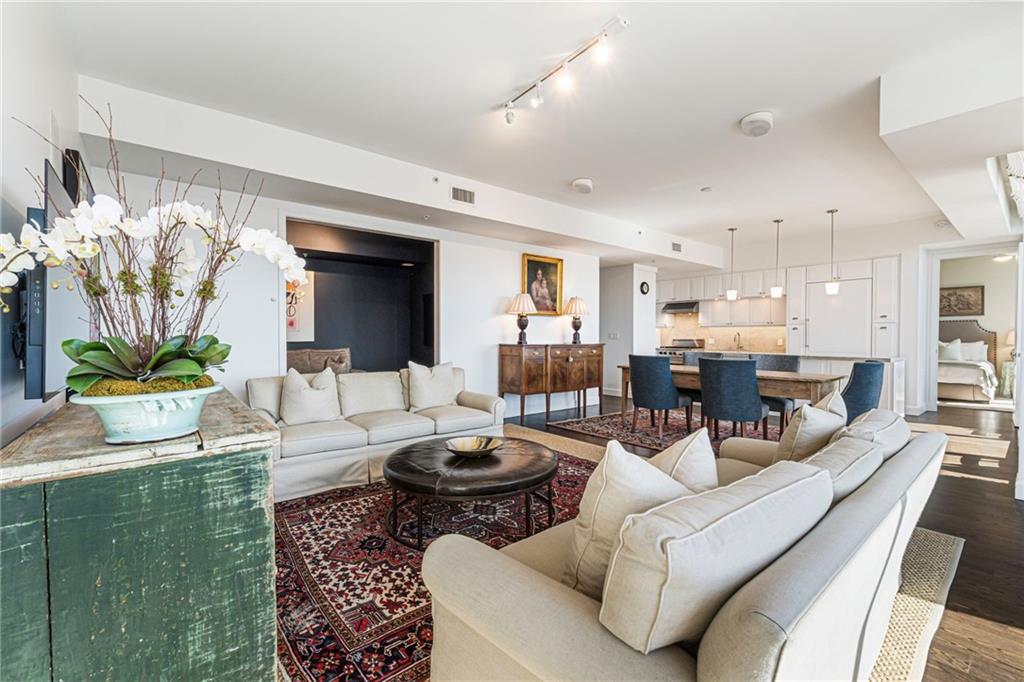 1820 Peachtree Road Northwest, Unit 1510 Atlanta, GA 30309 - Photo 4 of 75 a living room with furniture and a fireplace