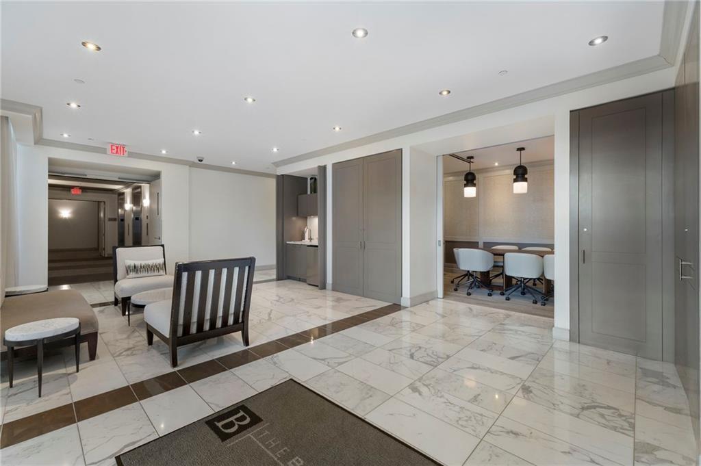 1820 Peachtree Road Northwest, Unit 1510 Atlanta, GA 30309 - Photo 66 of 75 a view of a hallway with couch and a dining table