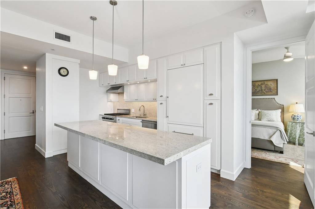 1820 Peachtree Road Northwest, Unit 1510 Atlanta, GA 30309 - Photo 7 of 75 a kitchen with white cabinets and sink