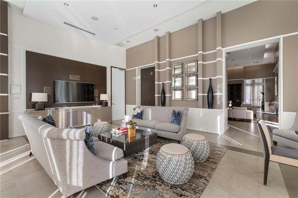 1820 Peachtree Road Northwest, Unit 1510 Atlanta, GA 30309 - Photo 72 of 75 a living room with furniture and a flat screen tv