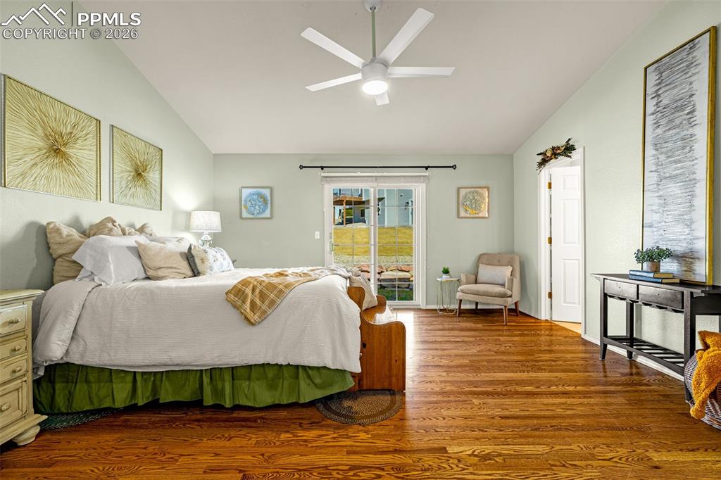 1310 Bison Ridge Drive Colorado Springs, CO 80919 - Photo 15 of 45 a living room with furniture and wooden floor