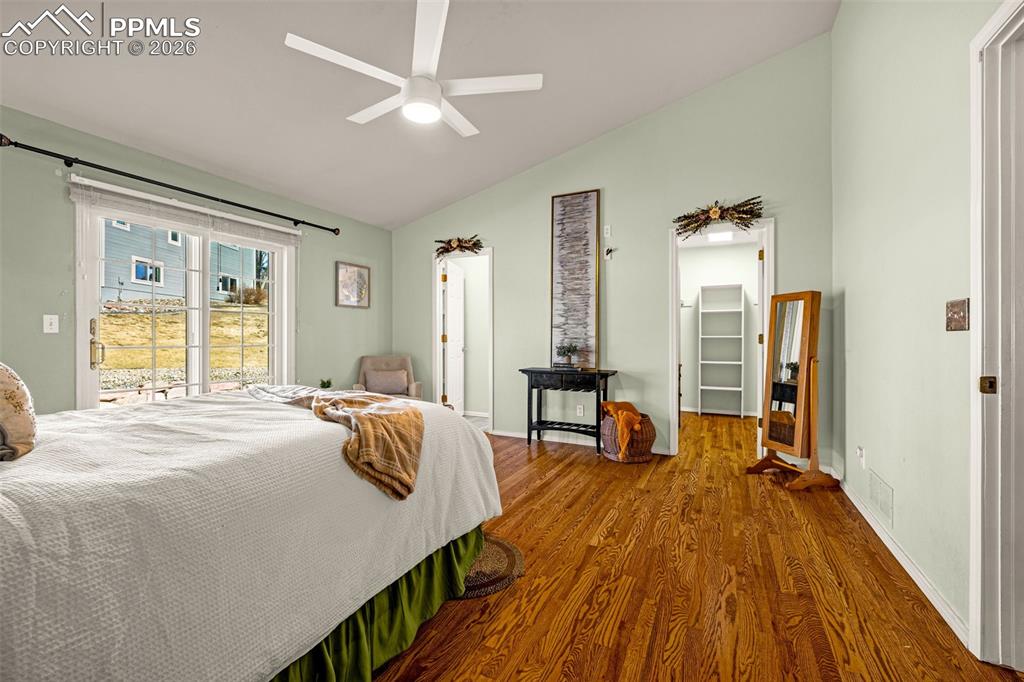 1310 Bison Ridge Drive Colorado Springs, CO 80919 - Photo 17 of 45 a bedroom with furniture and a wooden floor