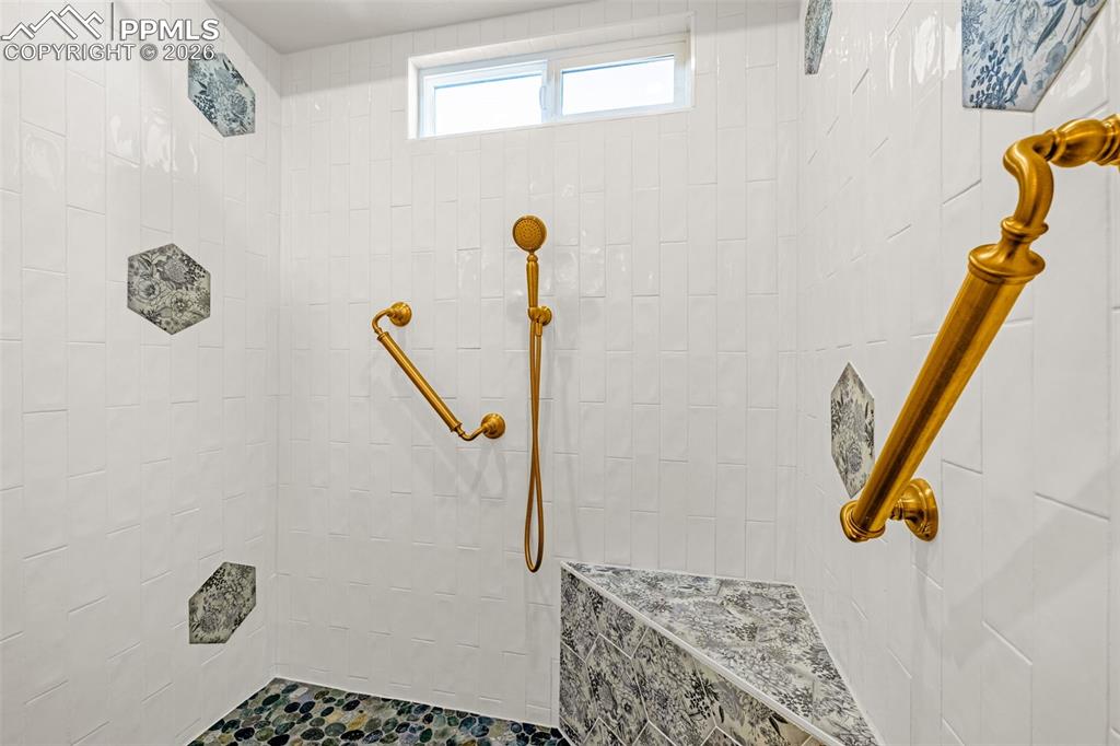 1310 Bison Ridge Drive Colorado Springs, CO 80919 - Photo 21 of 45 a bathroom with a shower