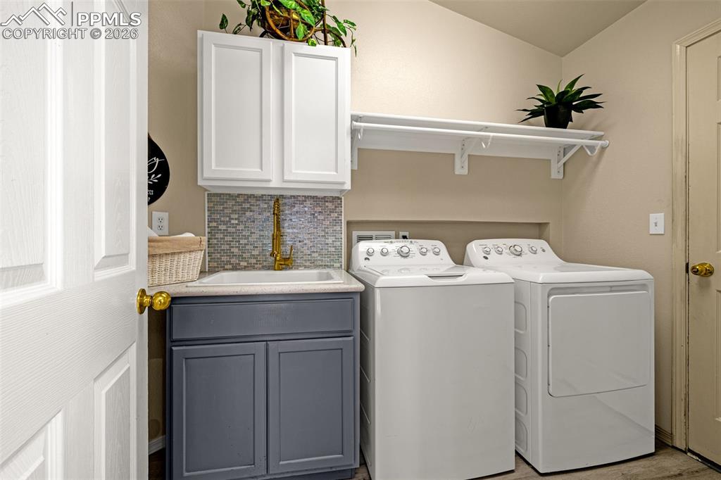 1310 Bison Ridge Drive Colorado Springs, CO 80919 - Photo 25 of 45 a utility room with dryer and washer