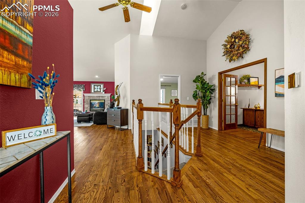 1310 Bison Ridge Drive Colorado Springs, CO 80919 - Photo 3 of 45 a living room with furniture and a wooden floor