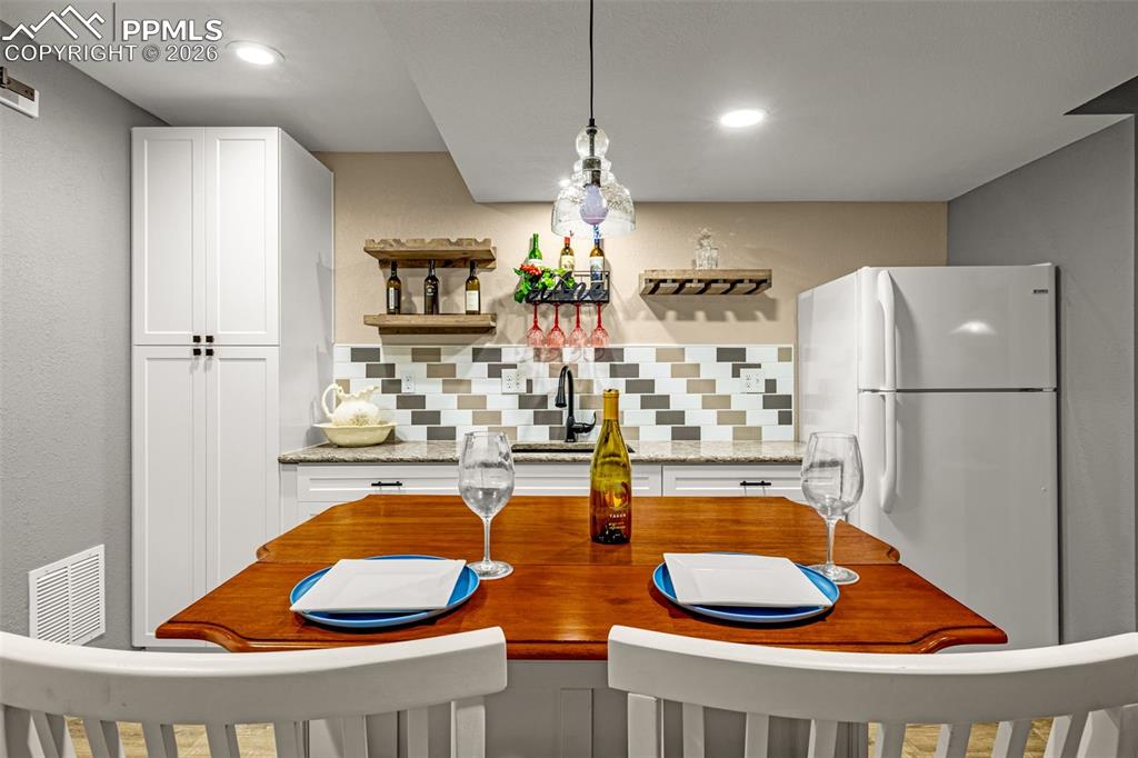 1310 Bison Ridge Drive Colorado Springs, CO 80919 - Photo 32 of 45 a bathroom with a tub sink and mirror