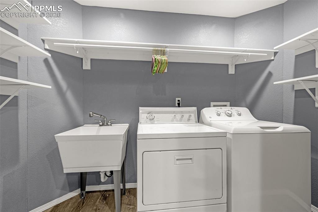 1310 Bison Ridge Drive Colorado Springs, CO 80919 - Photo 33 of 45 a utility room with dryer and washer