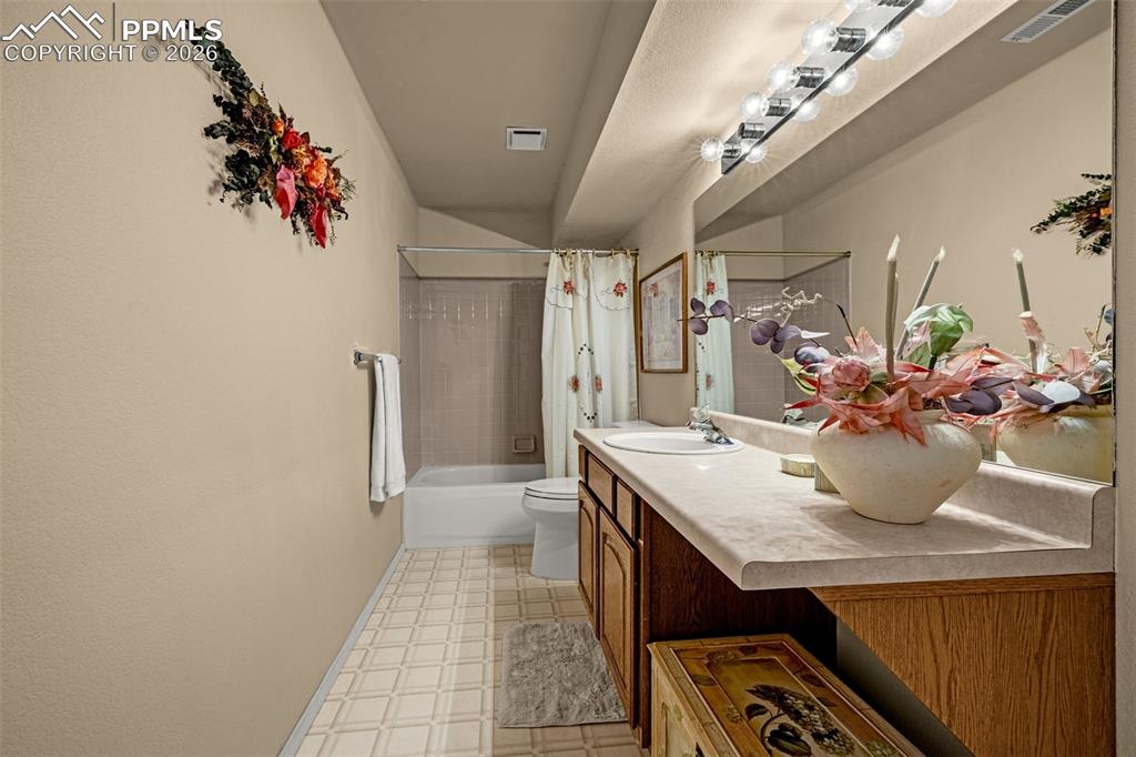 1310 Bison Ridge Drive Colorado Springs, CO 80919 - Photo 36 of 45 a room with a table and chairs