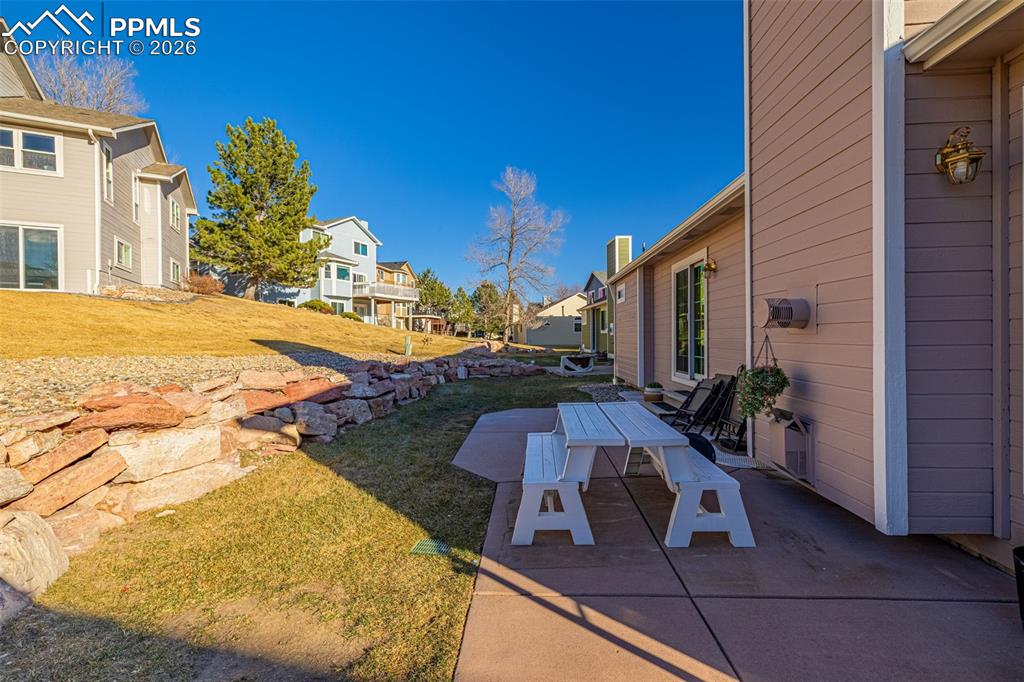 1310 Bison Ridge Drive Colorado Springs, CO 80919 - Photo 38 of 45 a view of a patio with swimming pool