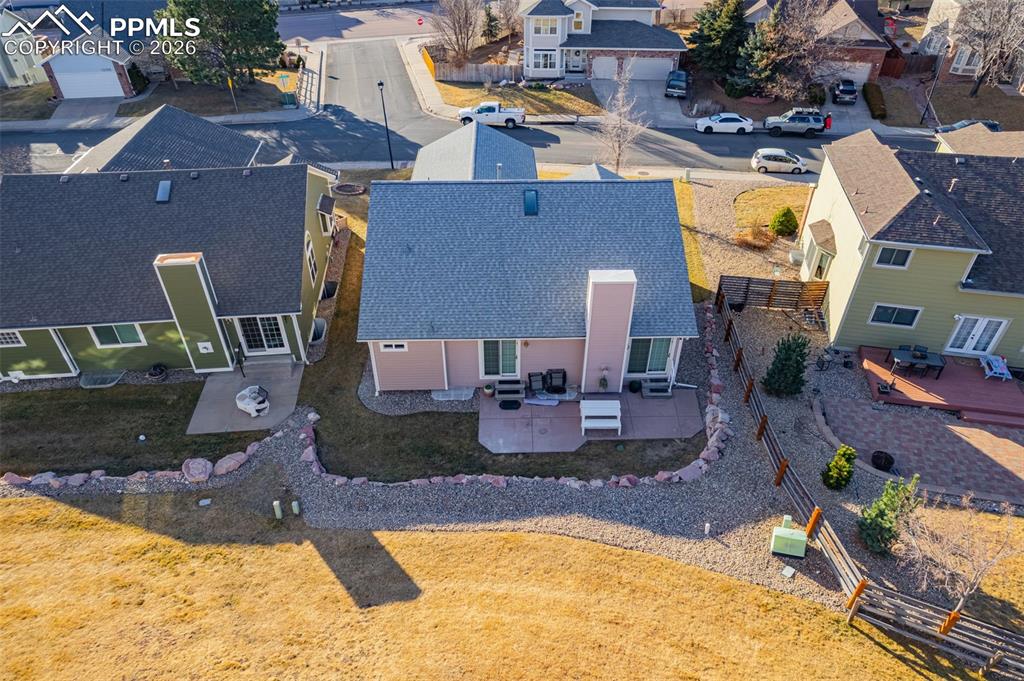 1310 Bison Ridge Drive Colorado Springs, CO 80919 - Photo 39 of 45 an aerial view of a house with swimming pool