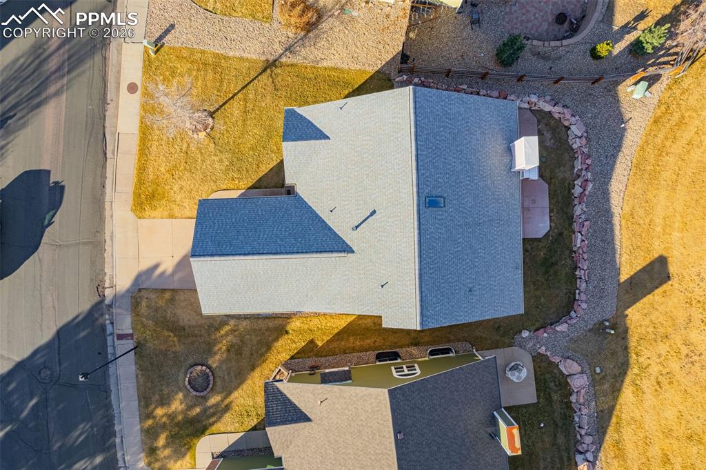 1310 Bison Ridge Drive Colorado Springs, CO 80919 - Photo 40 of 45 an aerial view of a house with swimming pool