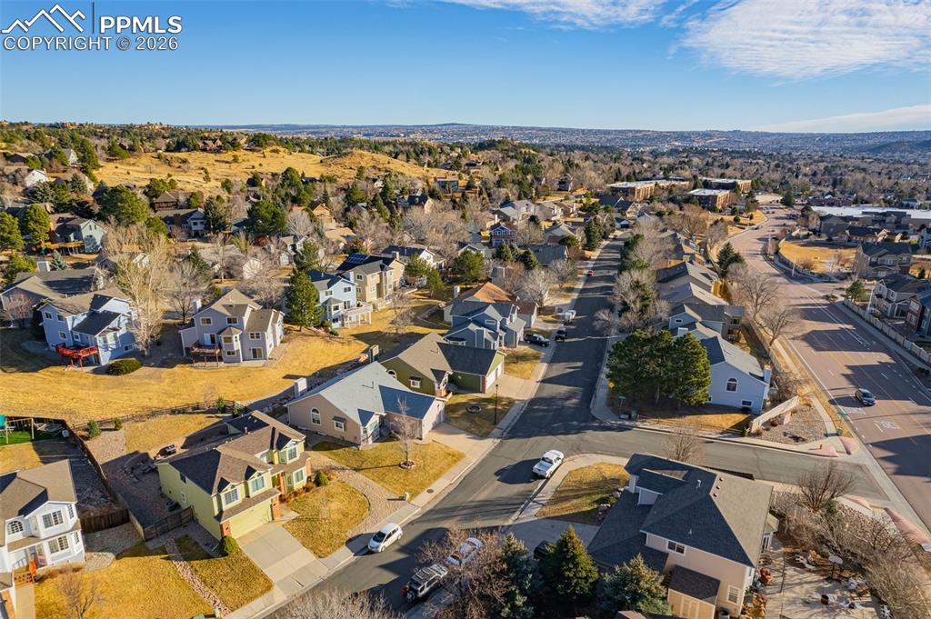 1310 Bison Ridge Drive Colorado Springs, CO 80919 - Photo 42 of 45 an aerial view of residential building and parking space