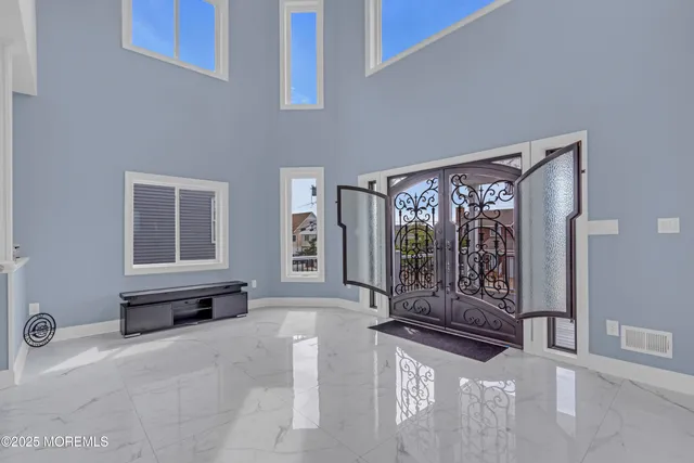 a living room with fireplace furniture and a flat screen tv