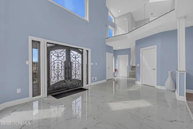 a room with lots of wooden furniture and a large window